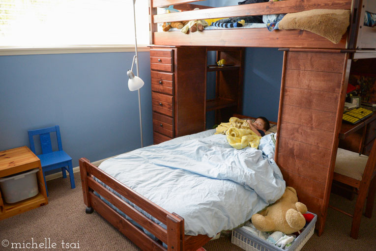 In with the new. He looks so teeny in that giant twin size bed.