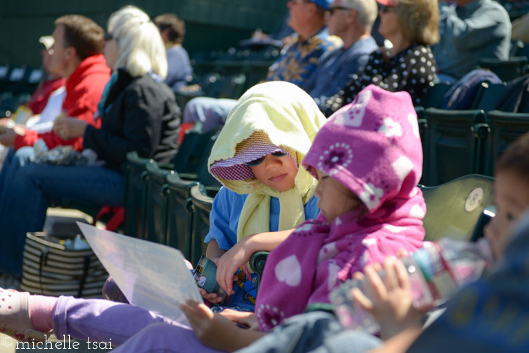 Bundled up like little homeless ladies. (What movie?) Actually, I think they were trying to keep the sun off their necks. Maybe.