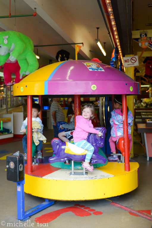 A quick ride on the mini carousel in the sketchy arcade.