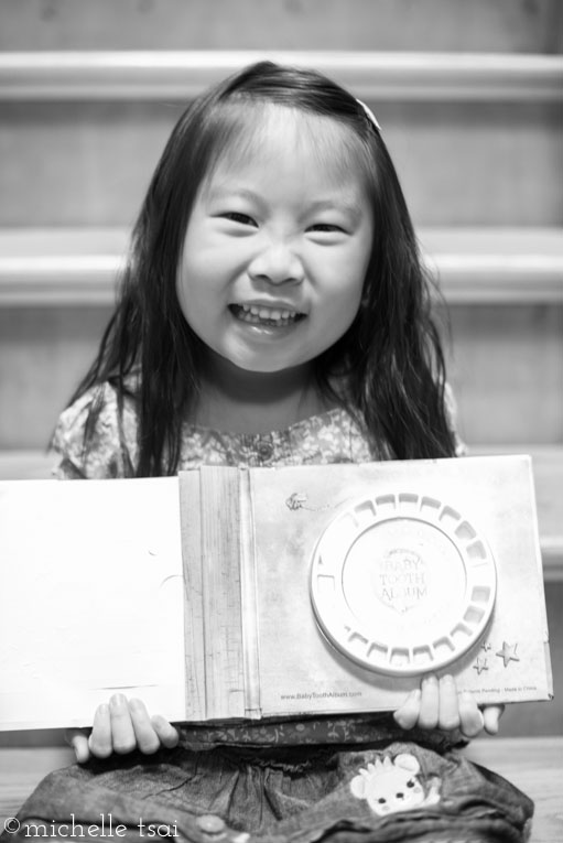 But the thing she was most excited about and amazed by? Getting her very own Tooth book and wondering how the Tooth Fairy got her very first tooth in there with the date written and everything. (Good thing she doesn't recognize Yours Truly's handwriting yet).