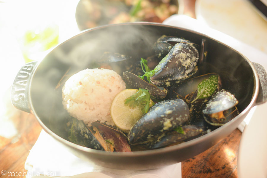 Steamed mussels in a green coconut curry sauce. 