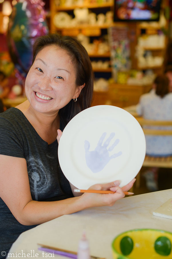 She was given the choice to decorate the plate herself, have her friends sign it, or have her mommy do something fancy and creative on it. She chose option #3 and told me to paint something really pretty on it. No pressure or anything. Not sure why I'm looking so giddy in this picture. It might have had something to do with the fact that this was the last birthday in our family of our party year and I was seeing the light at the end of the tunnel. Maybe.