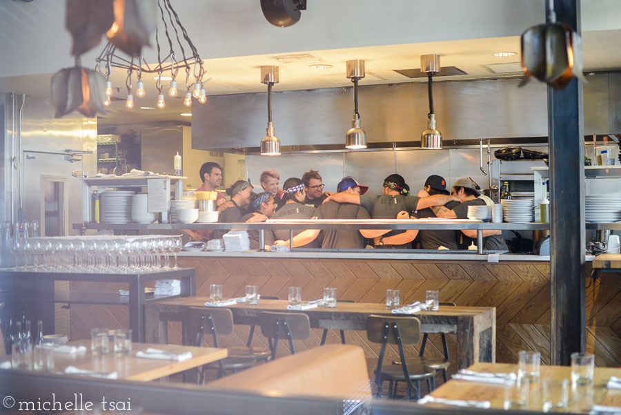 We got there early enough even to catch the staff's pre-service pump-themselves-up-huddle. Pretty cool to see. Also the pristine kitchen from which our many dishes were to emerge.