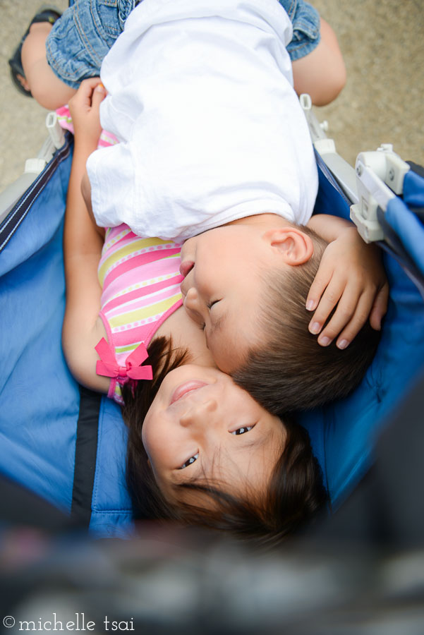 And when they were quite done with walking, she climbed into the stroller and he climbed right on top of her. She didn't mind, though. They rode like this all the way back to the car.