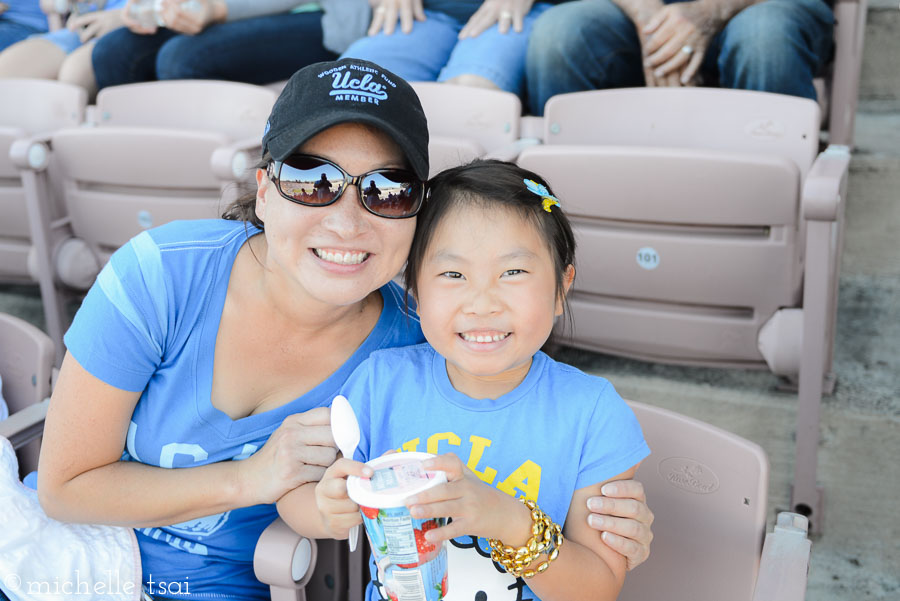 It was hot that day. Daddy bought her a frozen strawberry lemonade. It made her day. And kept her from wanting to leave five minutes after the game started.