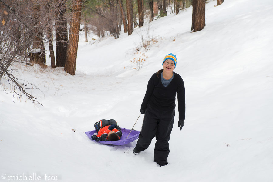 Then Jonah and I went around the back of the house and discovered an even bigger hill to sled down. Er, maybe I discovered it and Jonah came along for the ride.