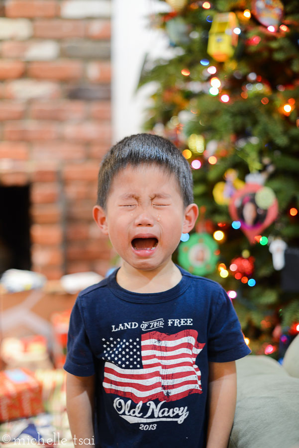 Christmas Eve. Not sure what's causing the crocodile tears but this is a sight we often see with this boy in his threes. This might have the teensiest bit to do with why I tend to prefer still pictures over video. Two words: no sound.