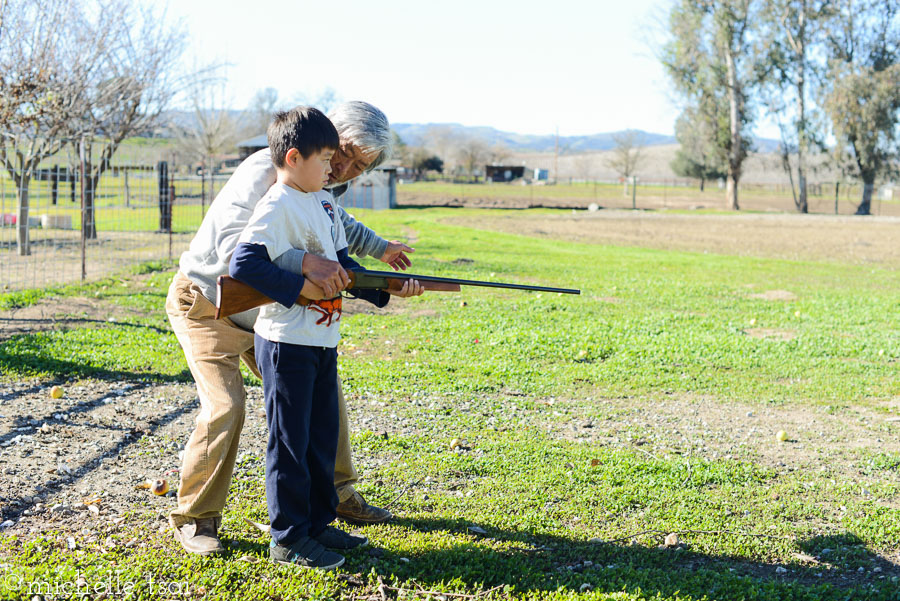 When apple picking/apple chucking were done, Grandpa had Mikey try firing this shotgun. Cuz that's what there is to do out in the country.