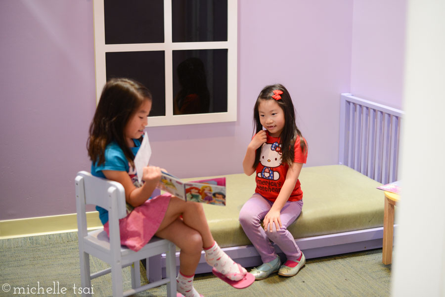 Storytime in the pink girl's room.