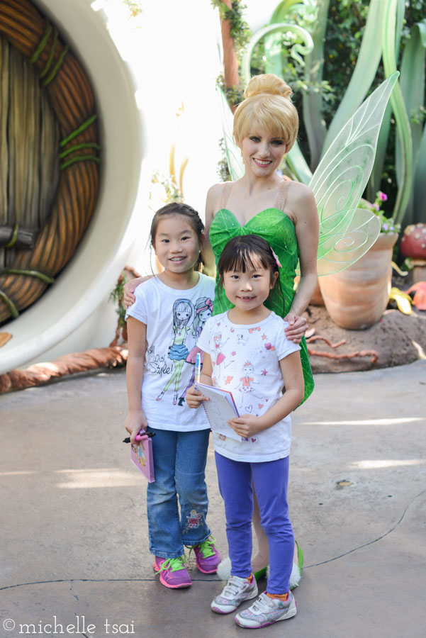 Hooray! Lauren was brave enough to meet Tinkerbell and take a picture with her this year. Unlike the time she bit her sister's shirt while clinging tightly to her.