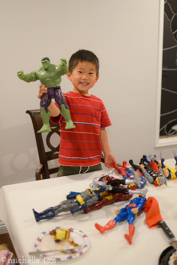 He was so~o~o excited to open his present. This pack of superheroes was all his daddy's doing.