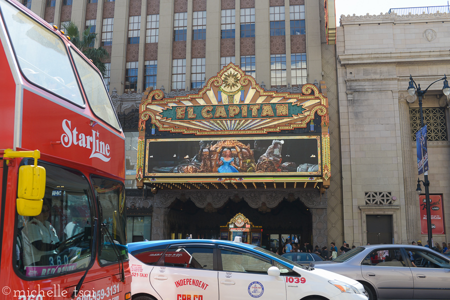 We made it across the street to get a picture of the front of the theater. I like the busy cityscape in the foreground with the red bus even.