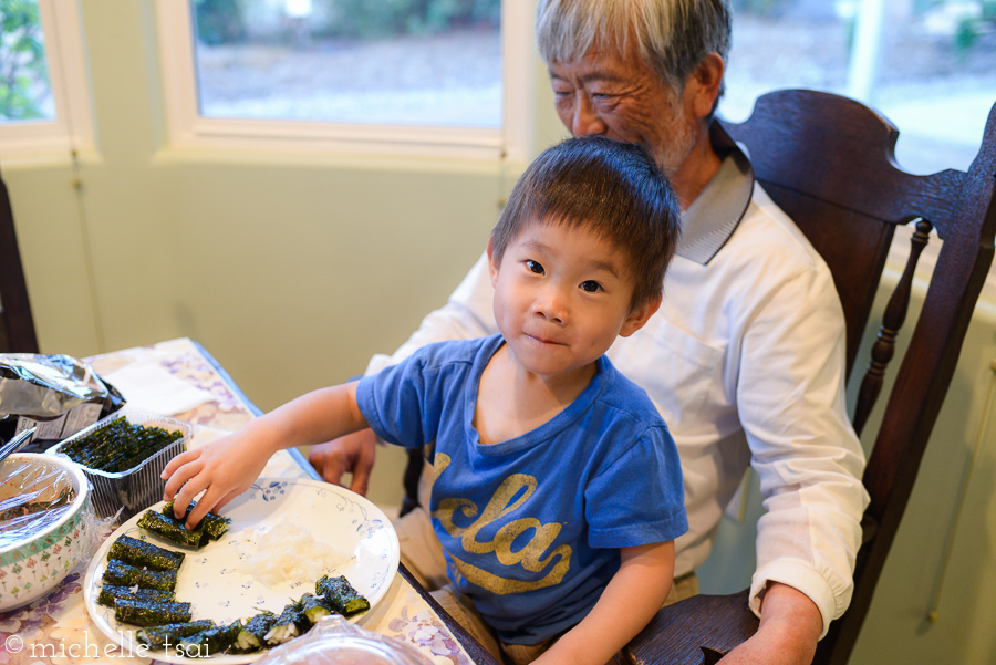 One more row of "kim-baps" (rice rolled up with roasted seaweed) made by Grandpa for this boy to eat.