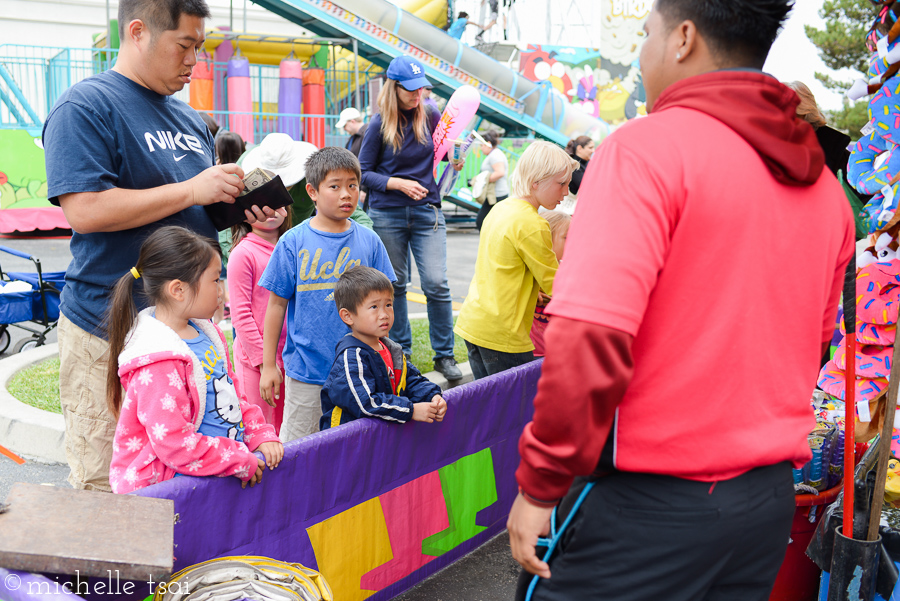 Which very often results in the wallet creaking open at the "every try a winner" booth.