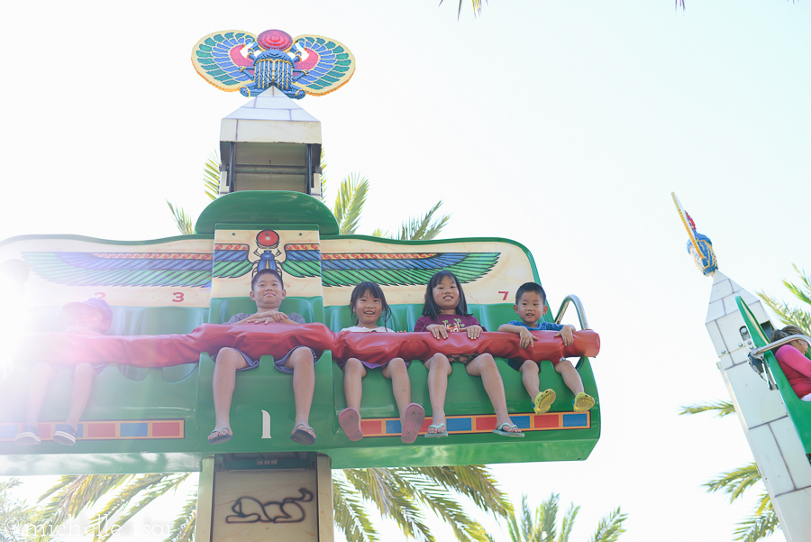 They all four sat together on this ride, though. Which brings to mind the last time our older two rode on something like this. Phil and I laughed about this as we watched our four go up and up and up. And saw their nervousness increase the higher they went.