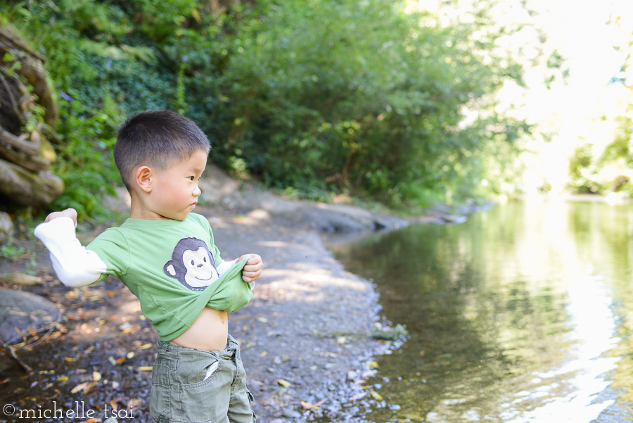 Using his shirt as a pouch to hold even more rocks.