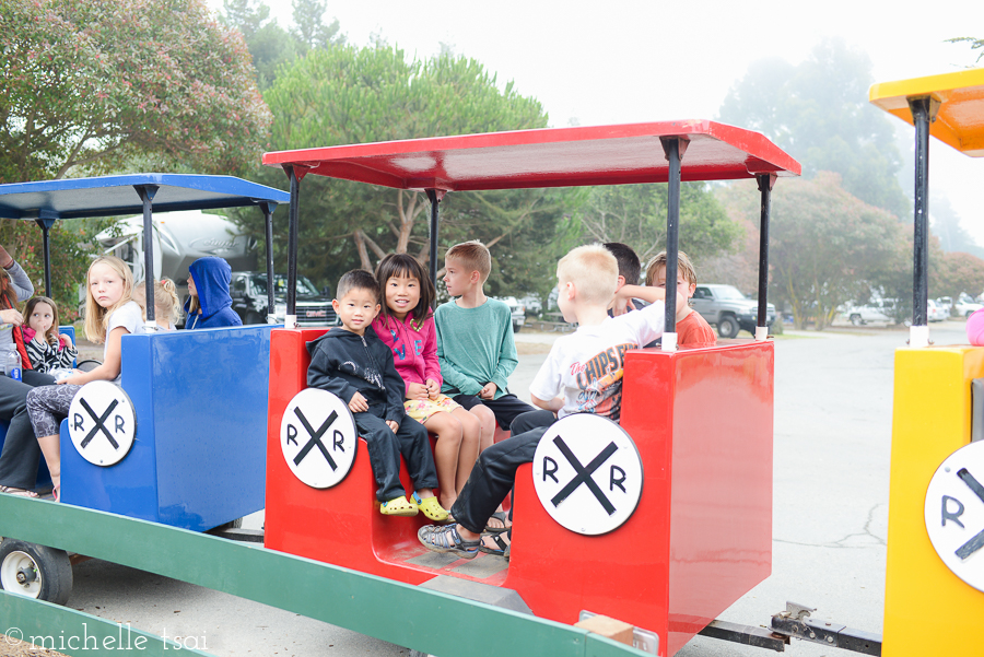 This nice kid let Allie and Jonah share his seat on the tiny kiddie train.