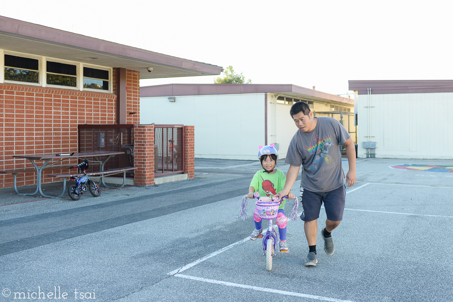 We started off in the smaller playground area. The same place where her sister learned to ride last summer.