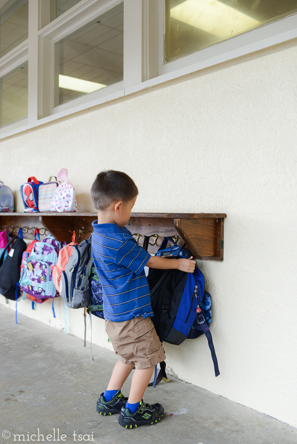 For he wanted to hang up his stuff and get in there to get the preschool fun started.