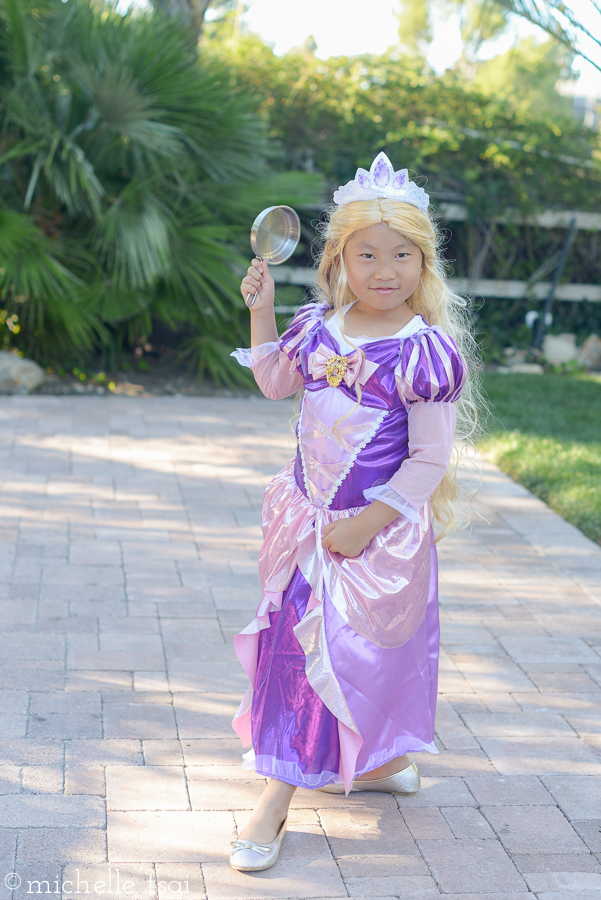 Later that afternoon, we got them into the full costumes for pictures before heading off for a fun night of fall festival AND trick-or-treating. Rapunzel, this time with her blond hair and frying pan.