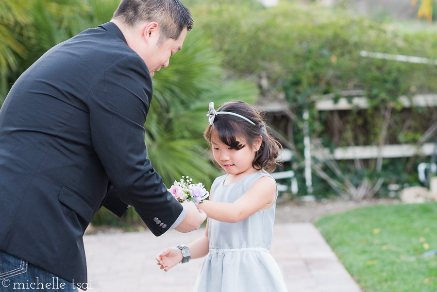 Someday, someone else will be putting a corsage on her wrist...