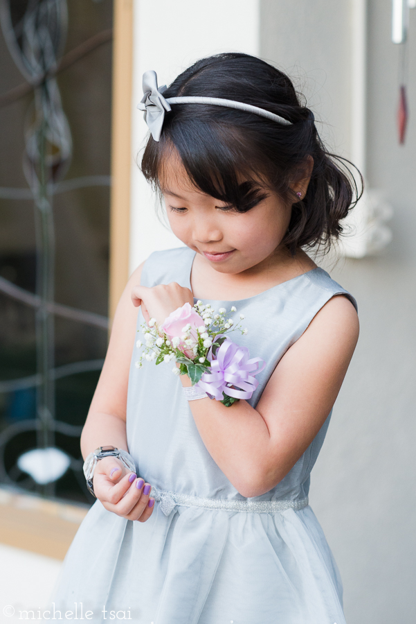 Meanwhile, little sis was quite taken with her corsage.