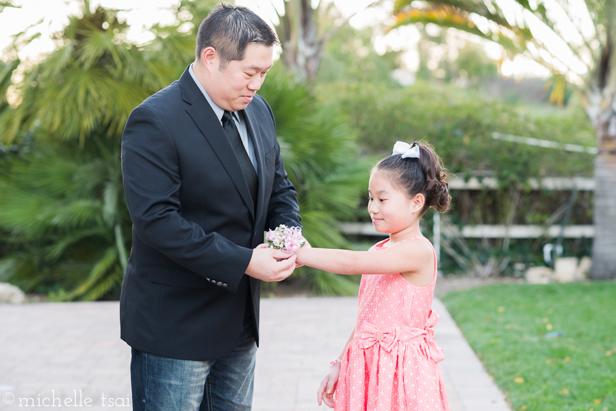 Very properly accepting her corsage.